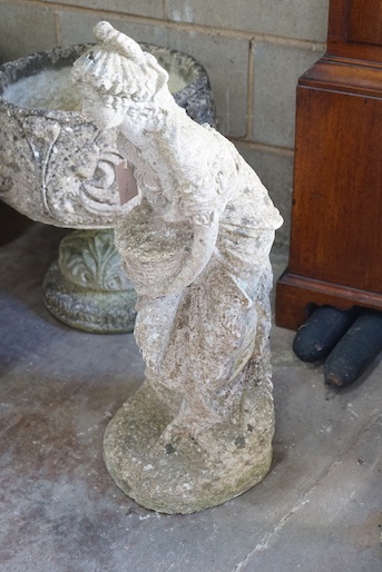 A reconstituted stone garden ornament of a lady with a basket of flowers, height 72cm